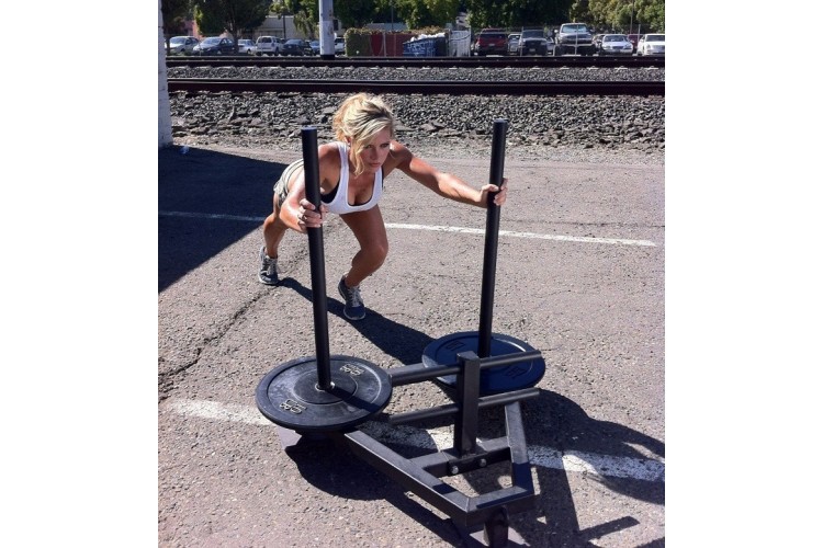 Carly pushing the 120LB Power Sled