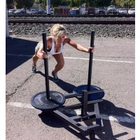 Carly pushing the 120LB Power Sled